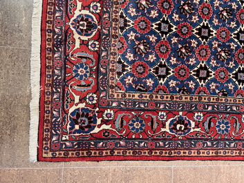 A Persian Varamin rug with floral design, wool on cotton, mid 20th C.