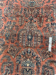 A Persian Sarouk rug with floral design, wool on cotton, first half 20th C.