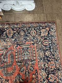 A Persian Sarouk rug with floral design, wool on cotton, first half 20th C.