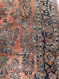 A Persian Sarouk rug with floral design, wool on cotton, first half 20th C.