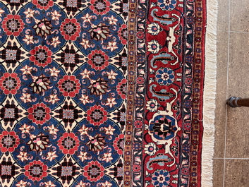A Persian Varamin rug with floral design, wool on cotton, mid 20th C.