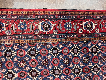 A Persian Varamin rug with floral design, wool on cotton, mid 20th C.