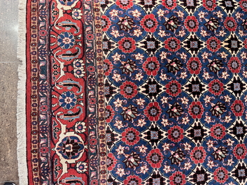 A Persian Varamin rug with floral design, wool on cotton, mid 20th C.