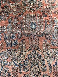 A Persian Sarouk rug with floral design, wool on cotton, first half 20th C.