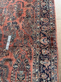 A Persian Sarouk rug with floral design, wool on cotton, first half 20th C.