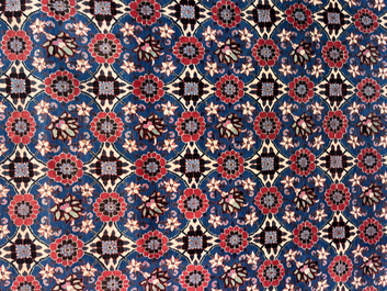 A Persian Varamin rug with floral design, wool on cotton, mid 20th C.