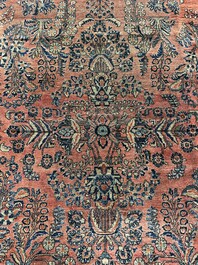 A Persian Sarouk rug with floral design, wool on cotton, first half 20th C.