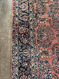 A Persian Sarouk rug with floral design, wool on cotton, first half 20th C.