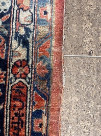 A Persian Sarouk rug with floral design, wool on cotton, first half 20th C.