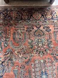 A Persian Sarouk rug with floral design, wool on cotton, first half 20th C.