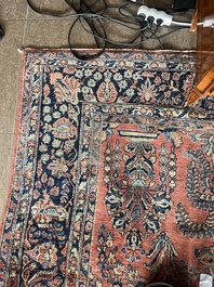 A Persian Sarouk rug with floral design, wool on cotton, first half 20th C.