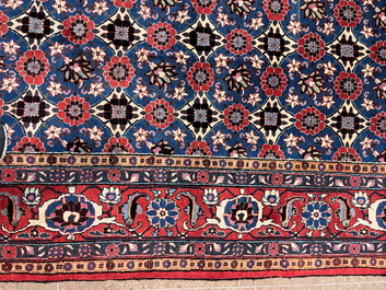 A Persian Varamin rug with floral design, wool on cotton, mid 20th C.