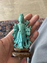 Two Chinese turquoise figures of Lan Caihe and a jade lady figure, 20th C.