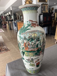 A Chinese famille verte vase with Immortals and their servants in a palace garden, Kangxi mark, 19th C.