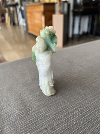 Two Chinese turquoise figures of Lan Caihe and a jade lady figure, 20th C.