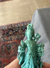 Two Chinese turquoise figures of Lan Caihe and a jade lady figure, 20th C.