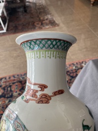 A Chinese famille verte vase with Immortals and their servants in a palace garden, Kangxi mark, 19th C.
