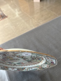 A Chinese octagonal famille rose 'Mandarin acrobat' plate, Qianlong
