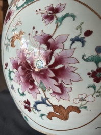 A Chinese famille rose jardini&egrave;re with floral design on a wooden base, 19th C.