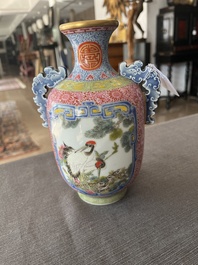 A Chinese falangcai vase with birds among blossoming branches, Qianlong mark, 20th C.