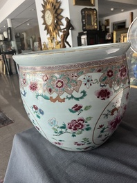 A Chinese famille rose jardini&egrave;re with floral design on a wooden base, 19th C.