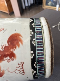 A Chinese famille rose and iron-red vase with a double design of antiquities and Buddhist lions, 19th C.