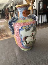 A Chinese falangcai vase with birds among blossoming branches, Qianlong mark, 20th C.