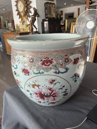 A Chinese famille rose jardini&egrave;re with floral design on a wooden base, 19th C.