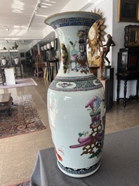 A Chinese famille rose and iron-red vase with a double design of antiquities and Buddhist lions, 19th C.
