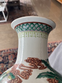 A Chinese famille verte vase with Immortals and their servants in a palace garden, Kangxi mark, 19th C.