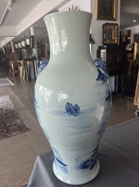 A Chinese blue and white baluster vase with an animated river landscape, 19th C.