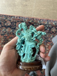 Two Chinese turquoise figures of Lan Caihe and a jade lady figure, 20th C.
