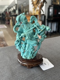 Two Chinese turquoise figures of Lan Caihe and a jade lady figure, 20th C.