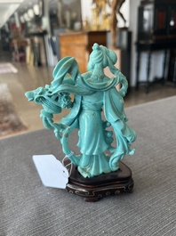 Two Chinese turquoise figures of Lan Caihe and a jade lady figure, 20th C.