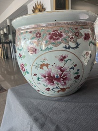 A Chinese famille rose jardini&egrave;re with floral design on a wooden base, 19th C.
