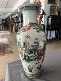 A Chinese famille verte vase with Immortals and their servants in a palace garden, Kangxi mark, 19th C.