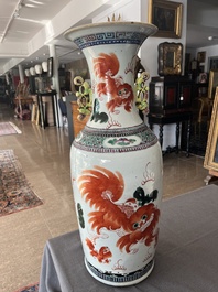 A Chinese famille rose and iron-red vase with a double design of antiquities and Buddhist lions, 19th C.