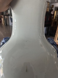 A Chinese blue and white baluster vase with an animated river landscape, 19th C.