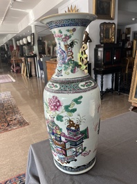 A Chinese famille rose and iron-red vase with a double design of antiquities and Buddhist lions, 19th C.