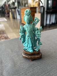 Two Chinese turquoise figures of Lan Caihe and a jade lady figure, 20th C.