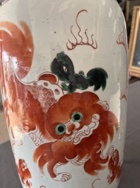 A Chinese famille rose and iron-red vase with a double design of antiquities and Buddhist lions, 19th C.