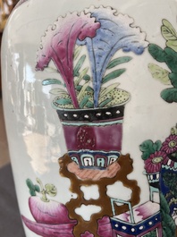 A Chinese famille rose and iron-red vase with a double design of antiquities and Buddhist lions, 19th C.