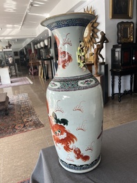 A Chinese famille rose and iron-red vase with a double design of antiquities and Buddhist lions, 19th C.