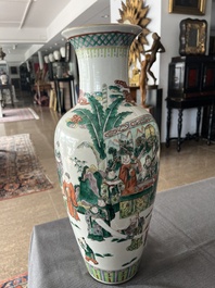 A Chinese famille verte vase with Immortals and their servants in a palace garden, Kangxi mark, 19th C.