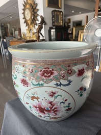 A Chinese famille rose jardini&egrave;re with floral design on a wooden base, 19th C.