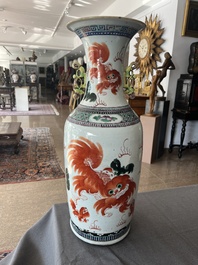 A Chinese famille rose and iron-red vase with a double design of antiquities and Buddhist lions, 19th C.