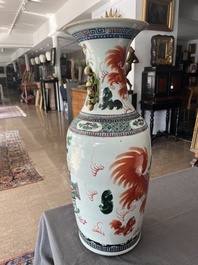A Chinese famille rose and iron-red vase with a double design of antiquities and Buddhist lions, 19th C.