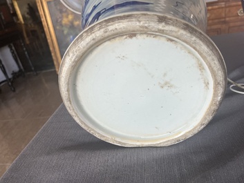 A Chinese blue and white baluster vase with an animated river landscape, 19th C.