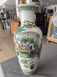 A Chinese famille verte vase with Immortals and their servants in a palace garden, Kangxi mark, 19th C.