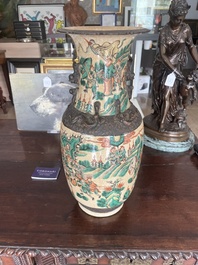 A pair of Chinese Nanking crackle glazed famille verte 'warrior' vases, 19th C.